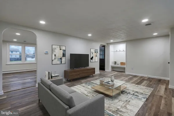 a kitchen with stainless steel appliances a refrigerator and a stove top oven