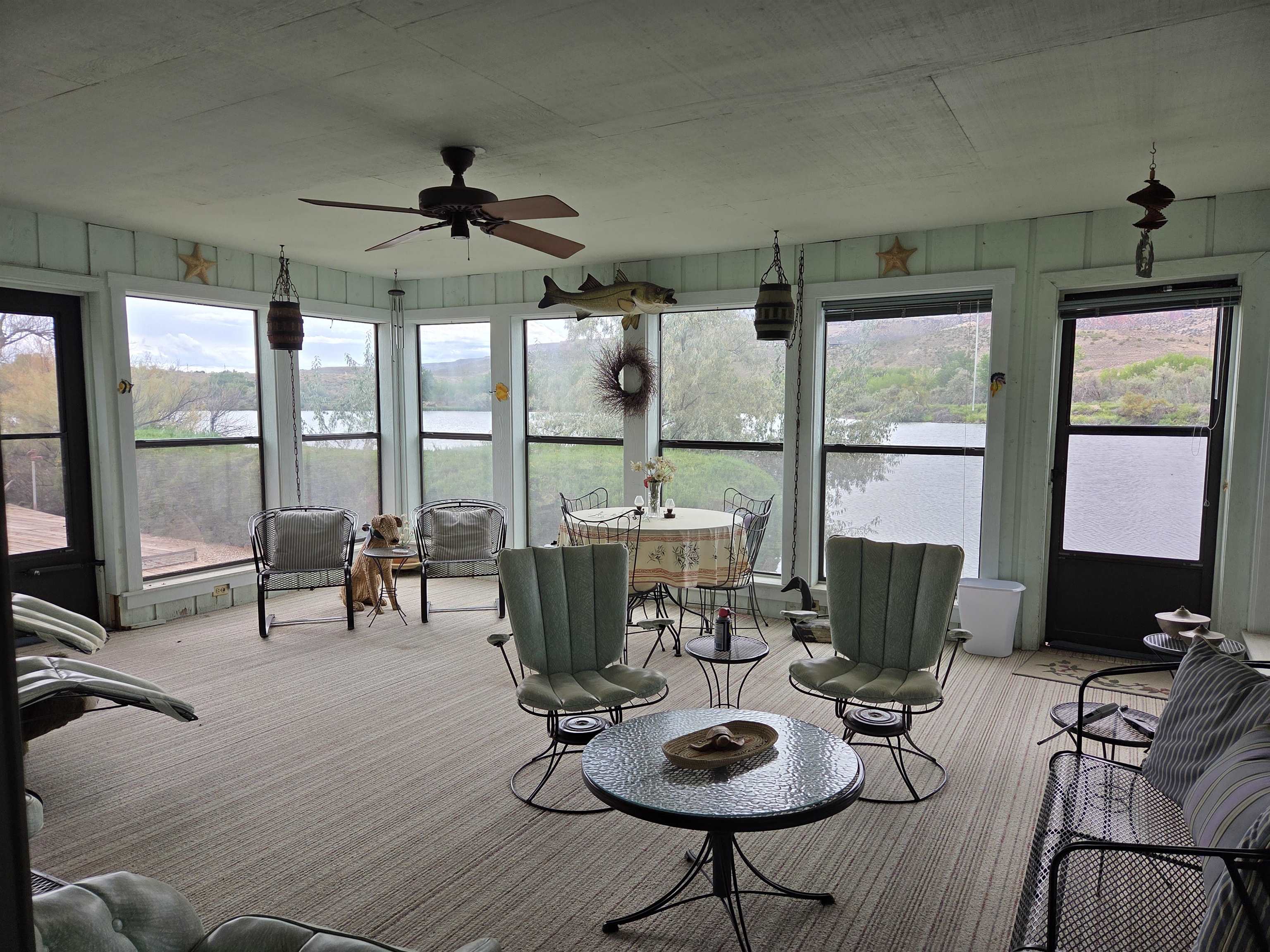 846 River Ranch Court Fruita, CO 81521 - Photo 23 of 24 a living room with furniture and floor to ceiling windows