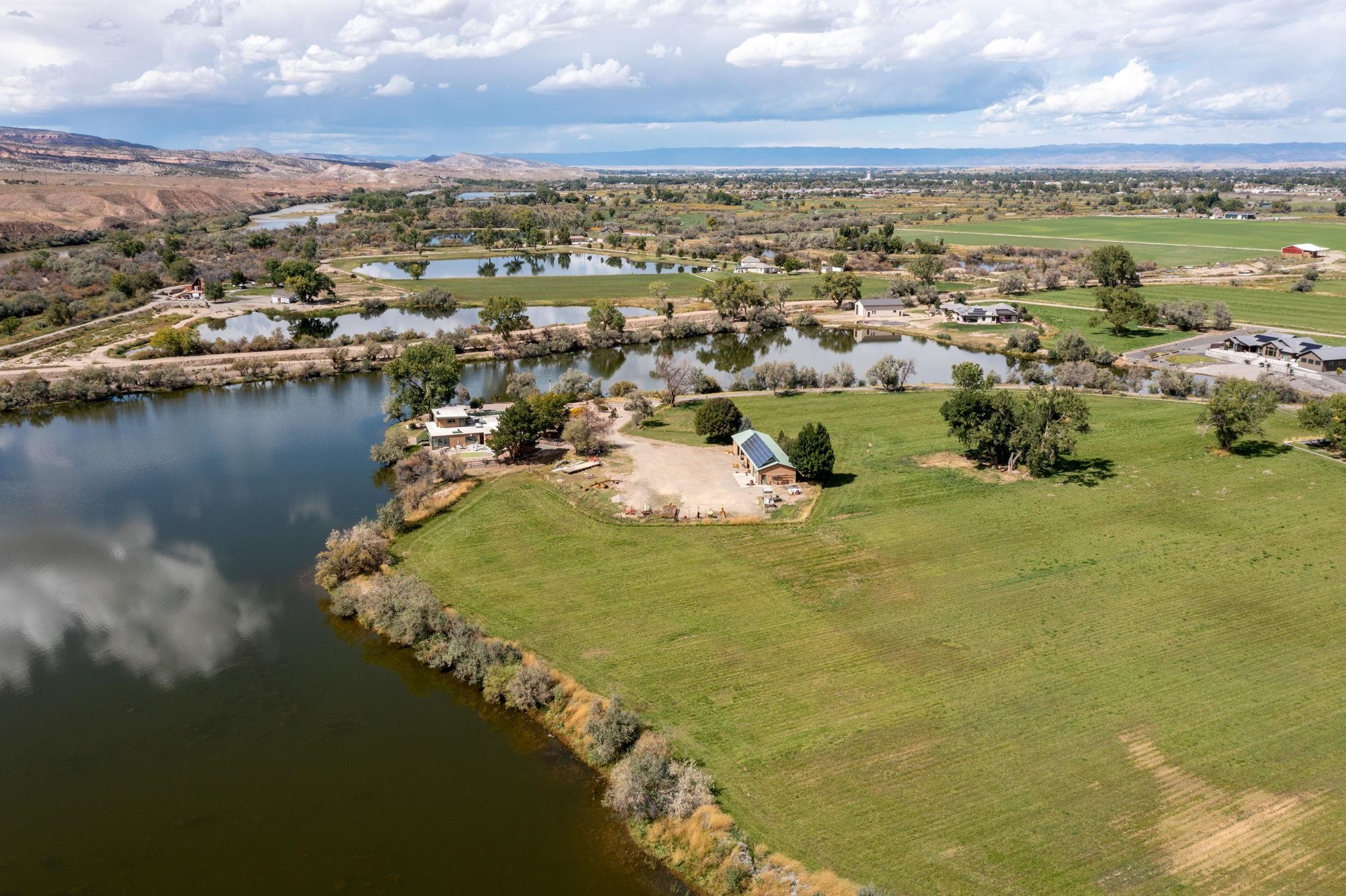 846 River Ranch Court Fruita, CO 81521 - Photo 4 of 24 a view of a lake with a city