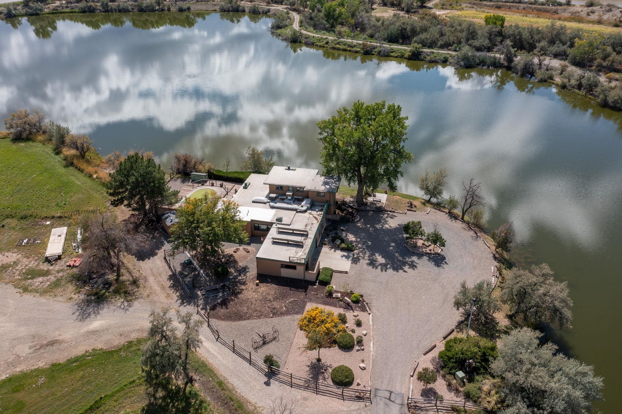 846 River Ranch Court Fruita, CO 81521 - Photo 6 of 24 an aerial view of a house with a yard and lake view