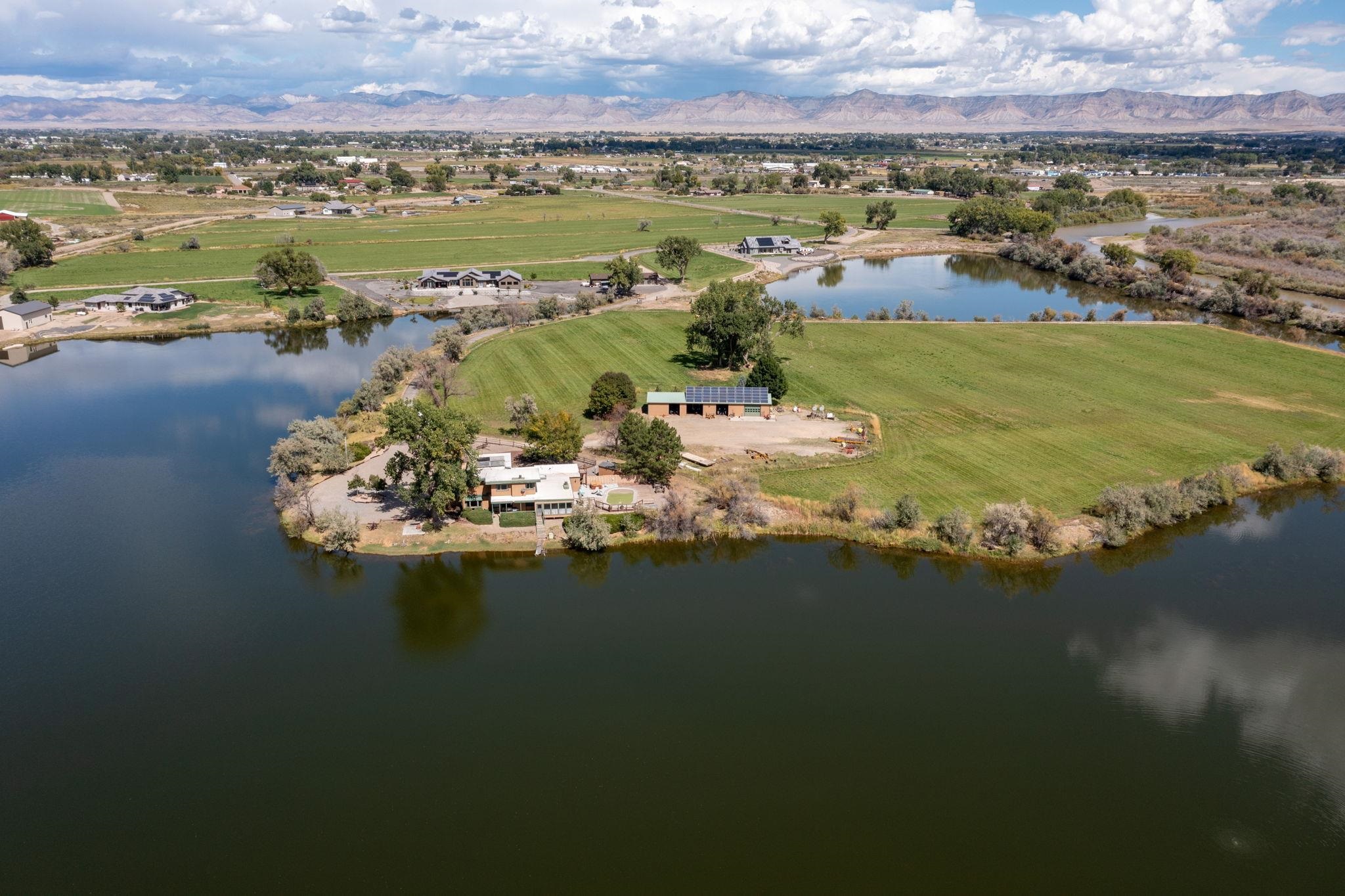 846 River Ranch Court Fruita, CO 81521 - Photo 8 of 24 a view of a lake with a mountain