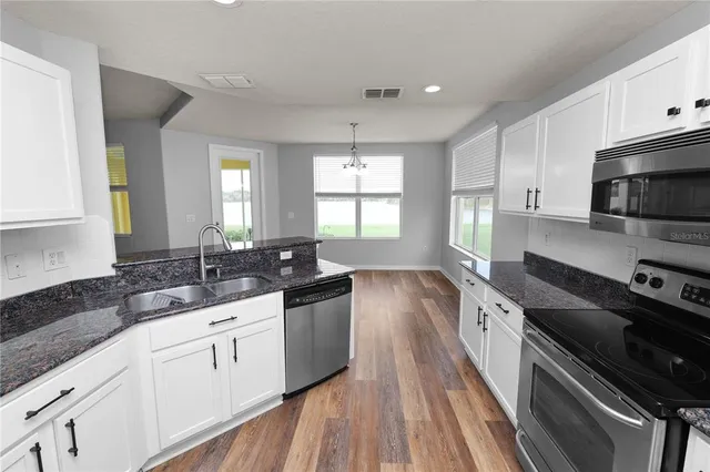 a view of an empty room and entryway