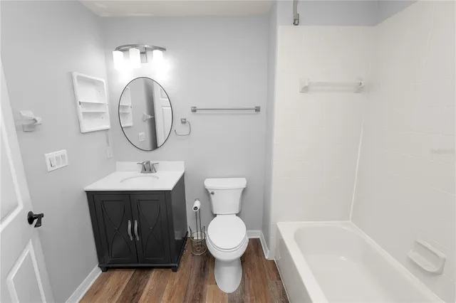 a view of an entryway with wooden floor