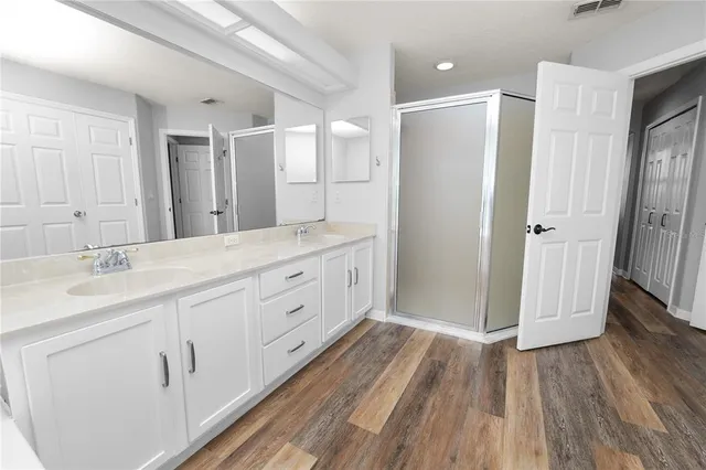 an aerial view of a houses with swimming pool