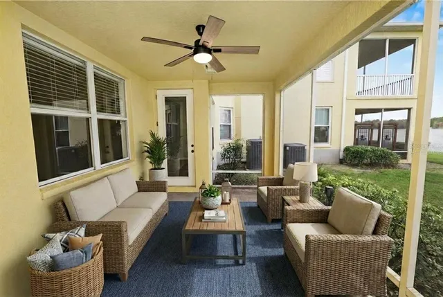 a kitchen with stainless steel appliances granite countertop a stove a refrigerator a microwave oven with a dining table and chairs