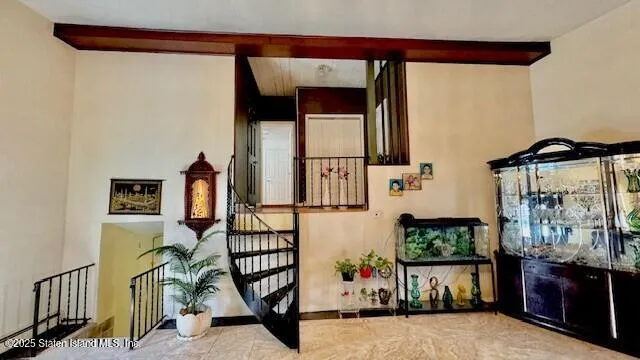 a view of living room with furniture and flat screen tv