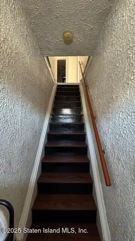 a kitchen with a refrigerator and a sink
