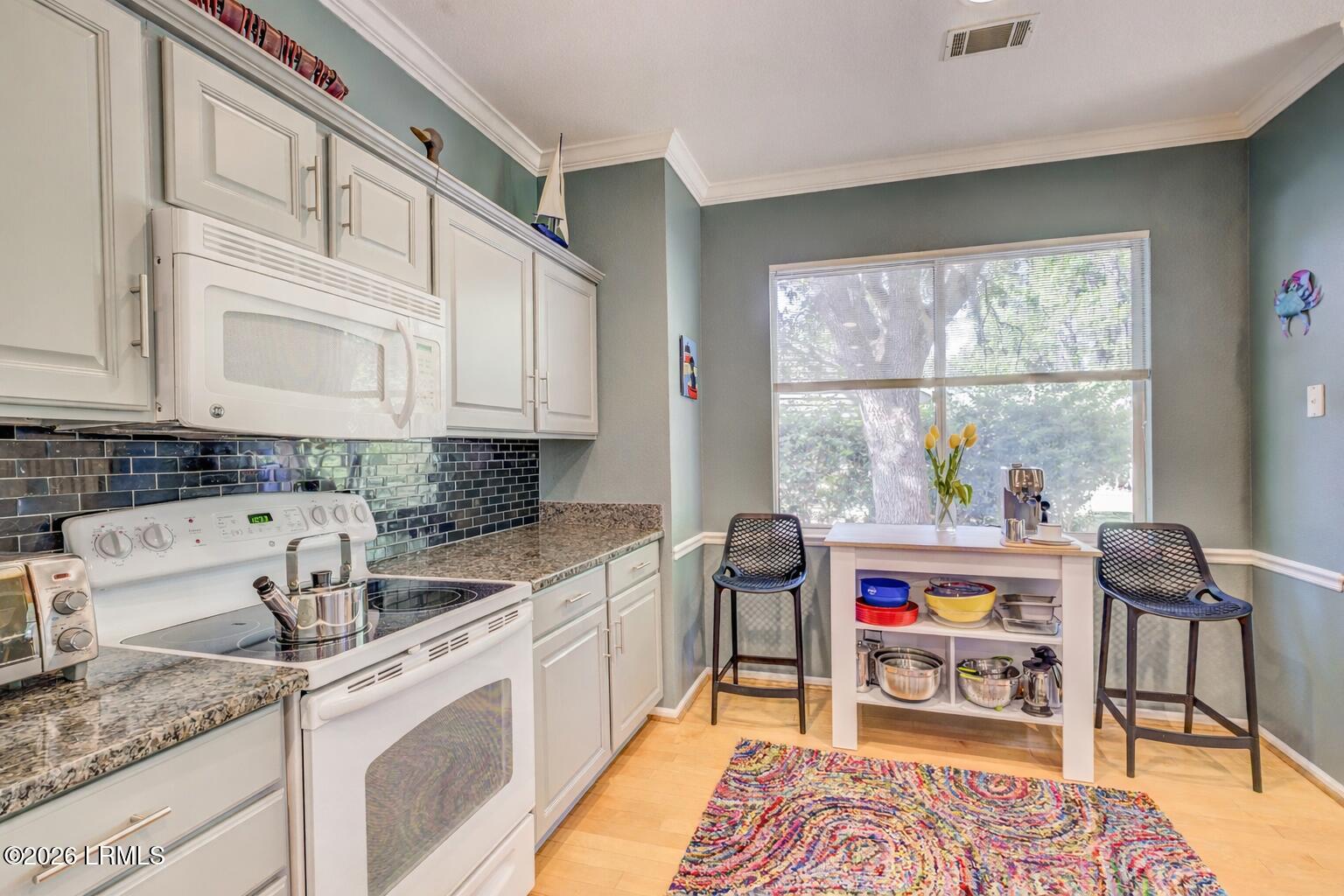5 Pelot Court Bluffton, SC 29909 - Photo 12 of 32 Bright kitchen with colorful accents