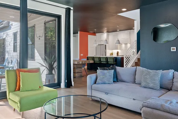 a living room with furniture and a large window