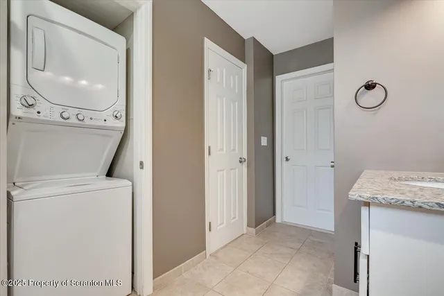 a bedroom with a large bed and a large window