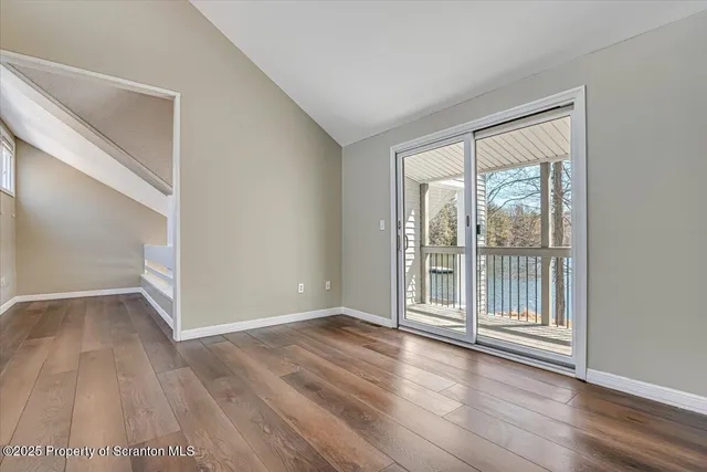 a bathroom with a shower sink and mirror