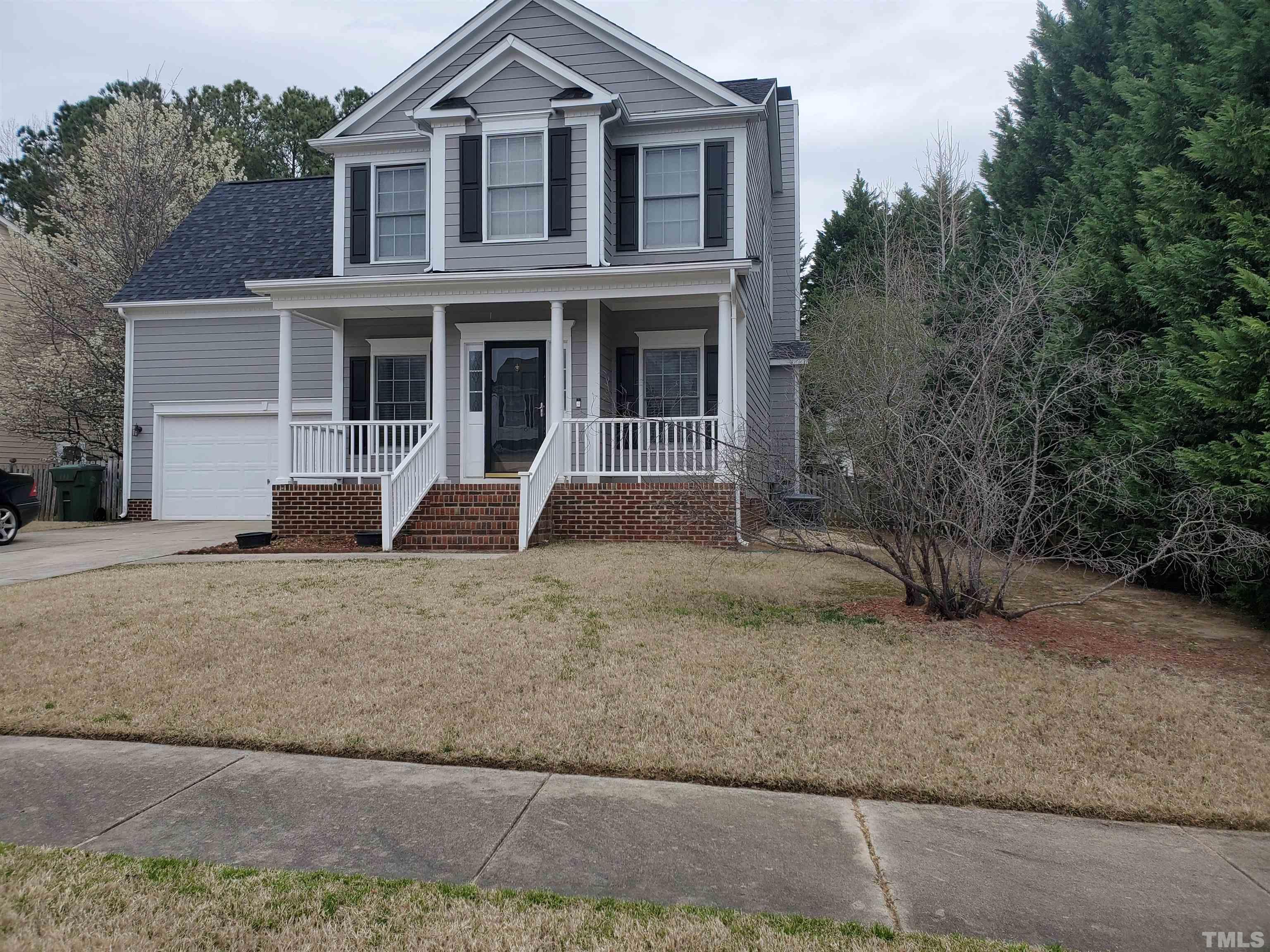 114 Calebra Way Cary, NC 27519 - Photo 1 of 50 a front view of a house with a yard