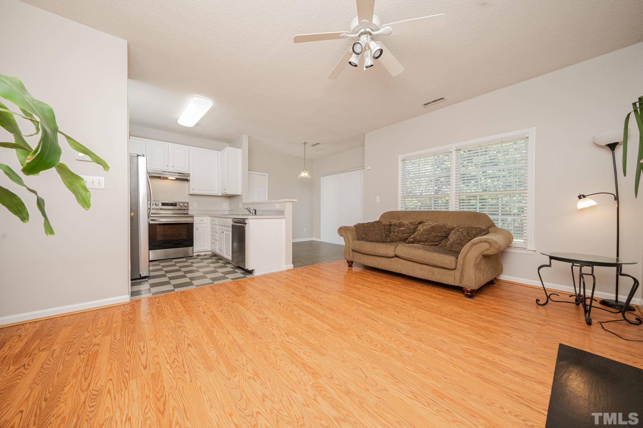 114 Calebra Way Cary, NC 27519 - Photo 12 of 50 a bedroom with a bed furniture and a flat screen tv