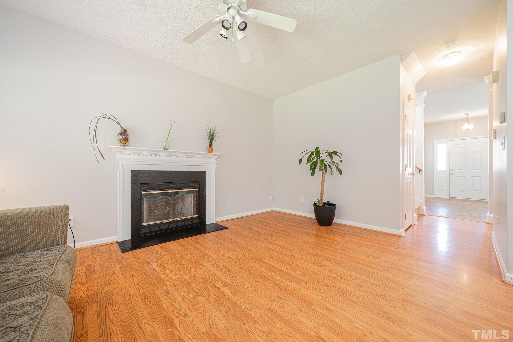 114 Calebra Way Cary, NC 27519 - Photo 14 of 50 a bedroom with a bed and a chandelier
