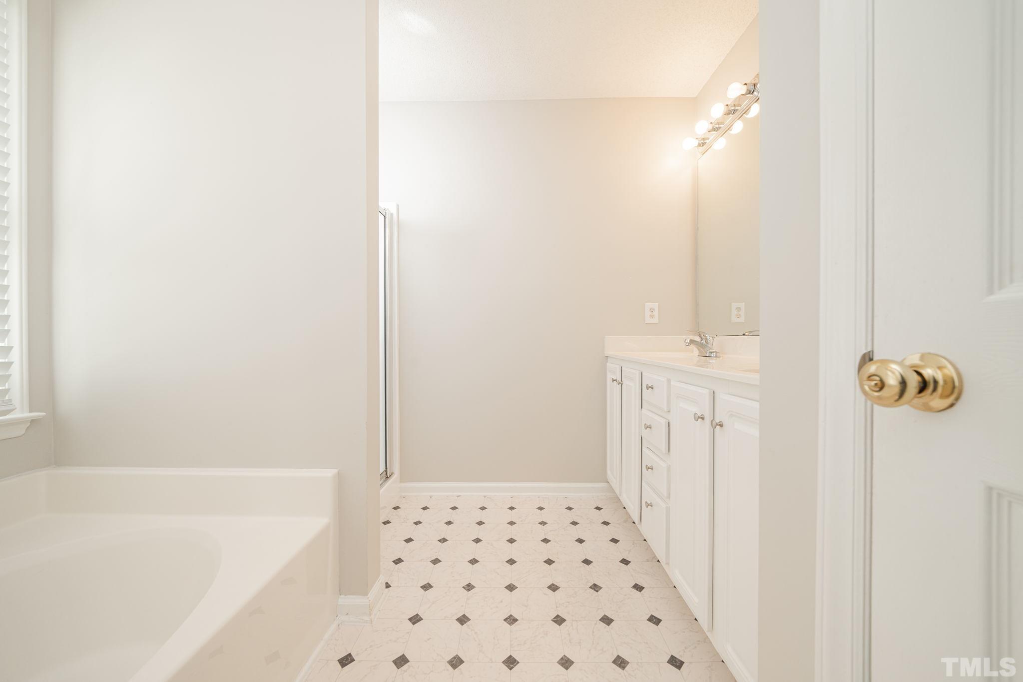 114 Calebra Way Cary, NC 27519 - Photo 25 of 50 a bathroom with a shower