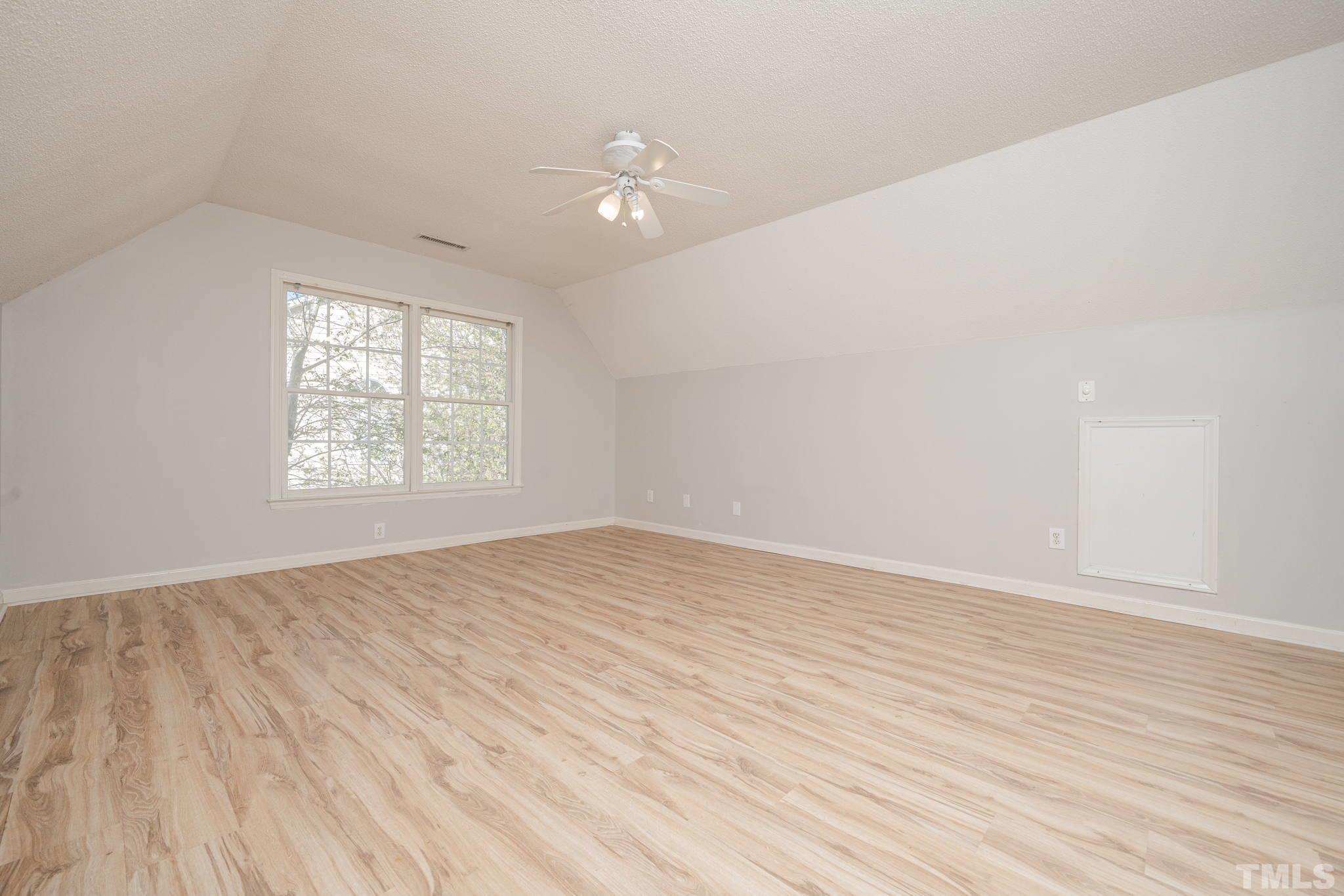 114 Calebra Way Cary, NC 27519 - Photo 30 of 50 an empty room with wooden floor and windows
