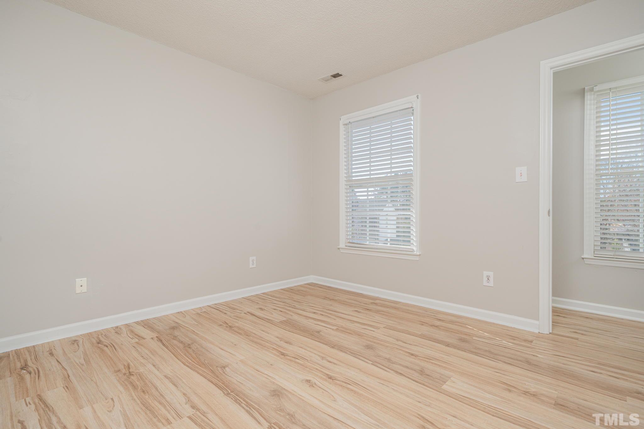 114 Calebra Way Cary, NC 27519 - Photo 31 of 50 wooden floor in an empty room with a window