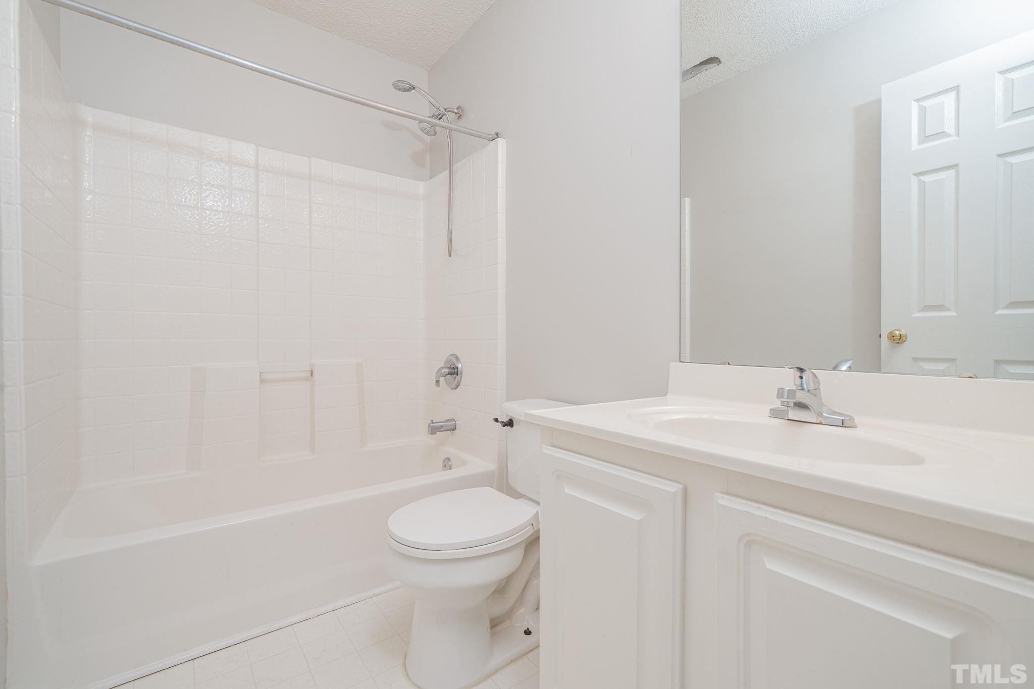114 Calebra Way Cary, NC 27519 - Photo 35 of 50 a bathroom with a sink a toilet and shower