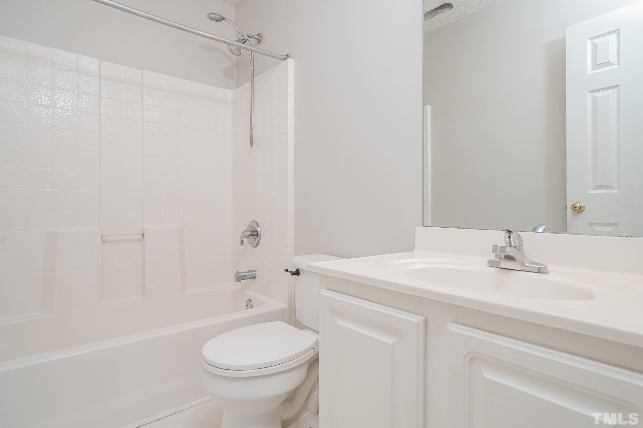114 Calebra Way Cary, NC 27519 - Photo 36 of 50 a bathroom with a sink a toilet and shower