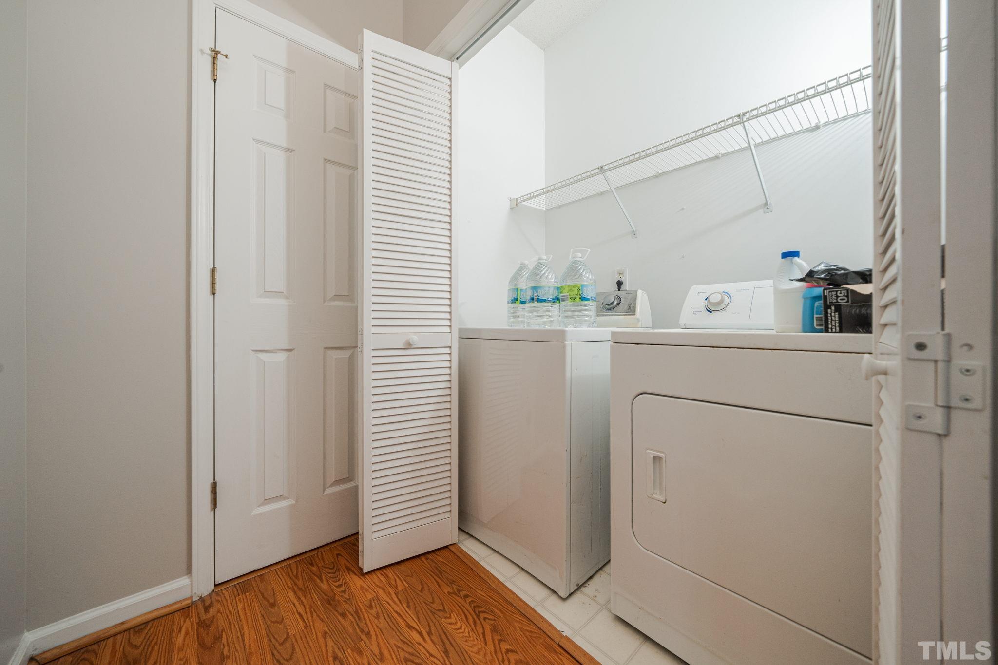 114 Calebra Way Cary, NC 27519 - Photo 37 of 50 a view of a storage and utility room with washer and dryer