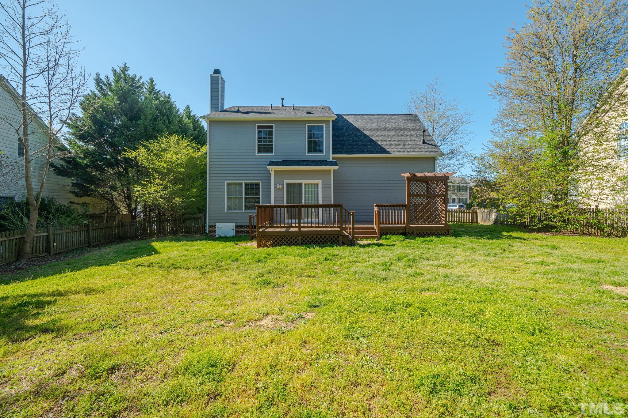 114 Calebra Way Cary, NC 27519 - Photo 47 of 50 a view of a house with a backyard