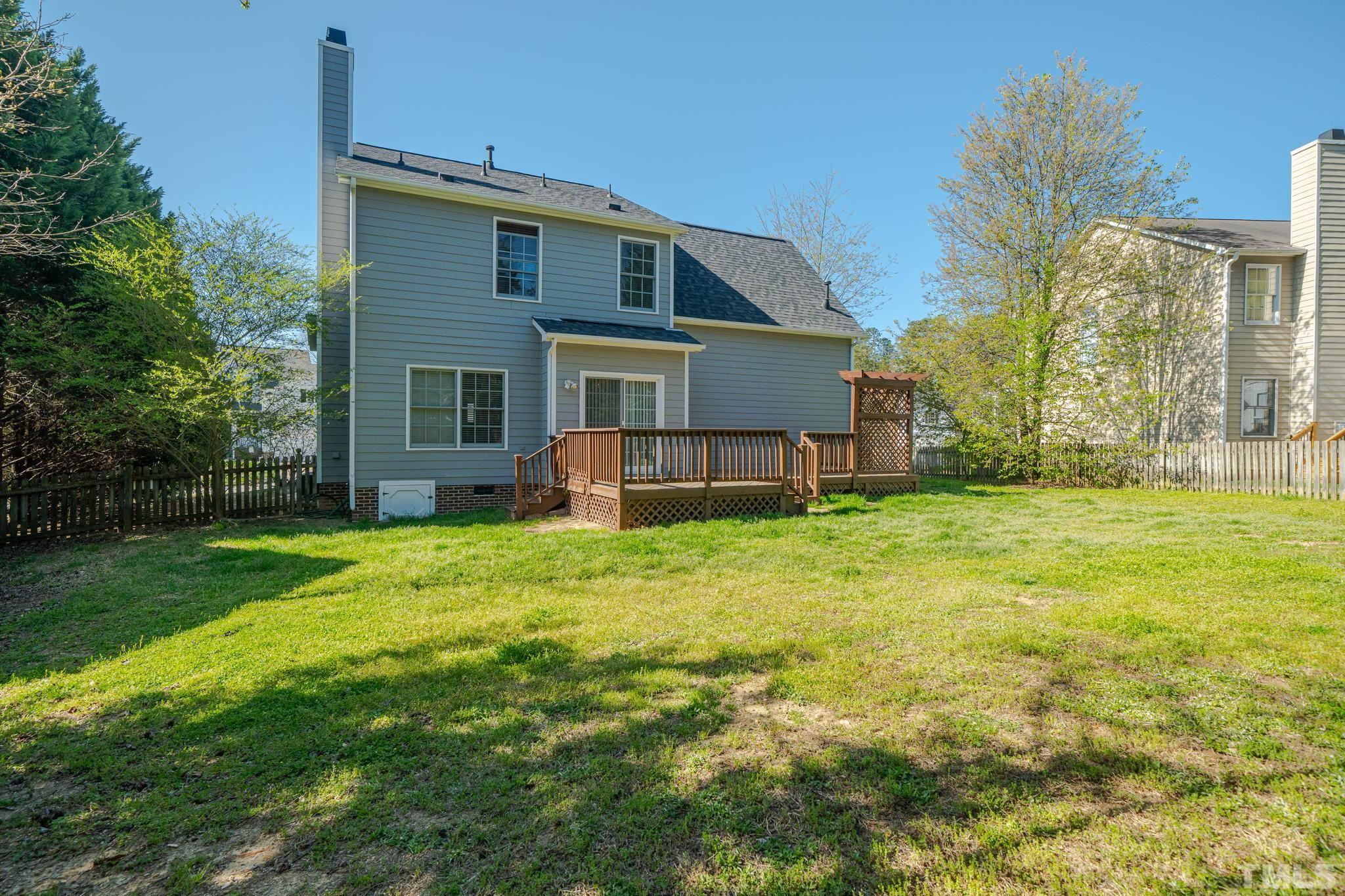 114 Calebra Way Cary, NC 27519 - Photo 49 of 50 a view of a house with backyard and garden