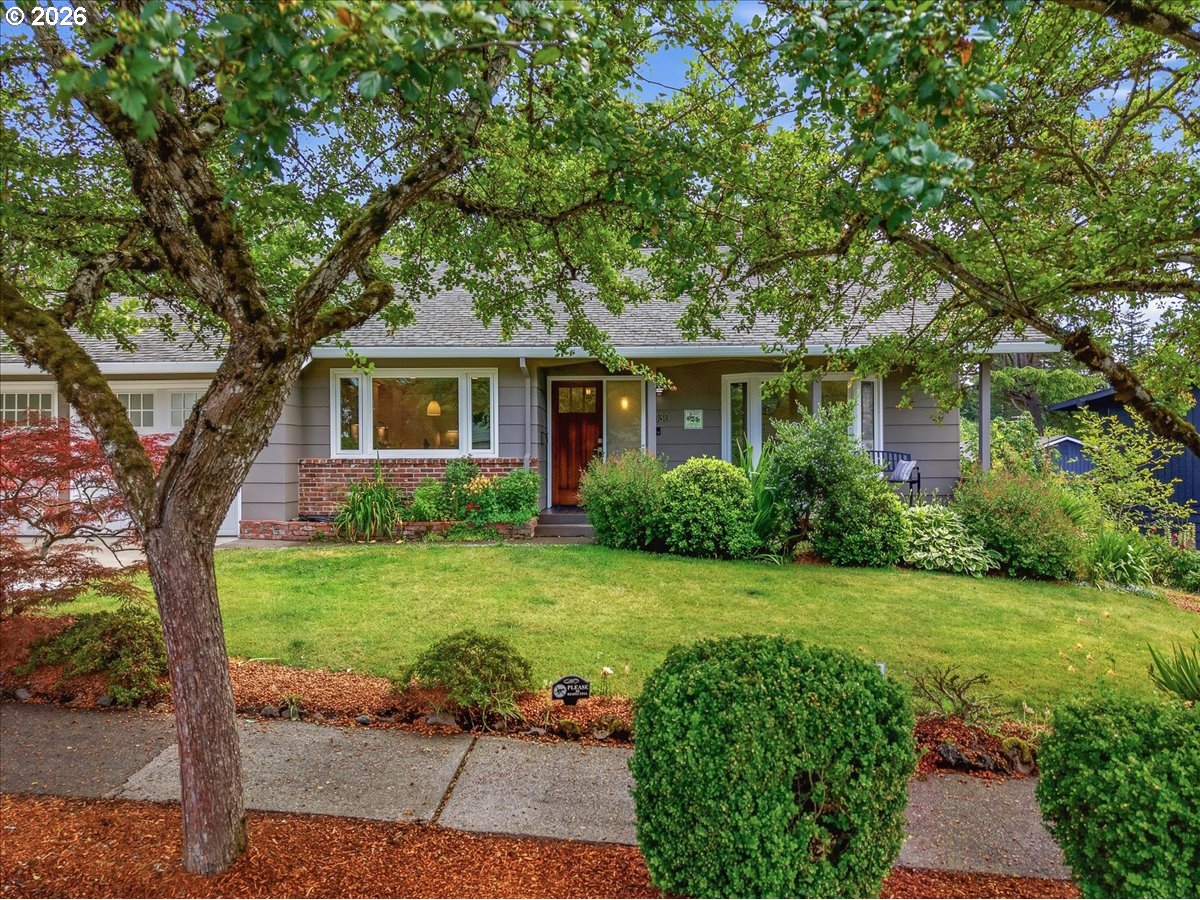3130 Southwest 116th Avenue Beaverton, OR 97005 - Photo 1 of 44 a front view of a house with garden