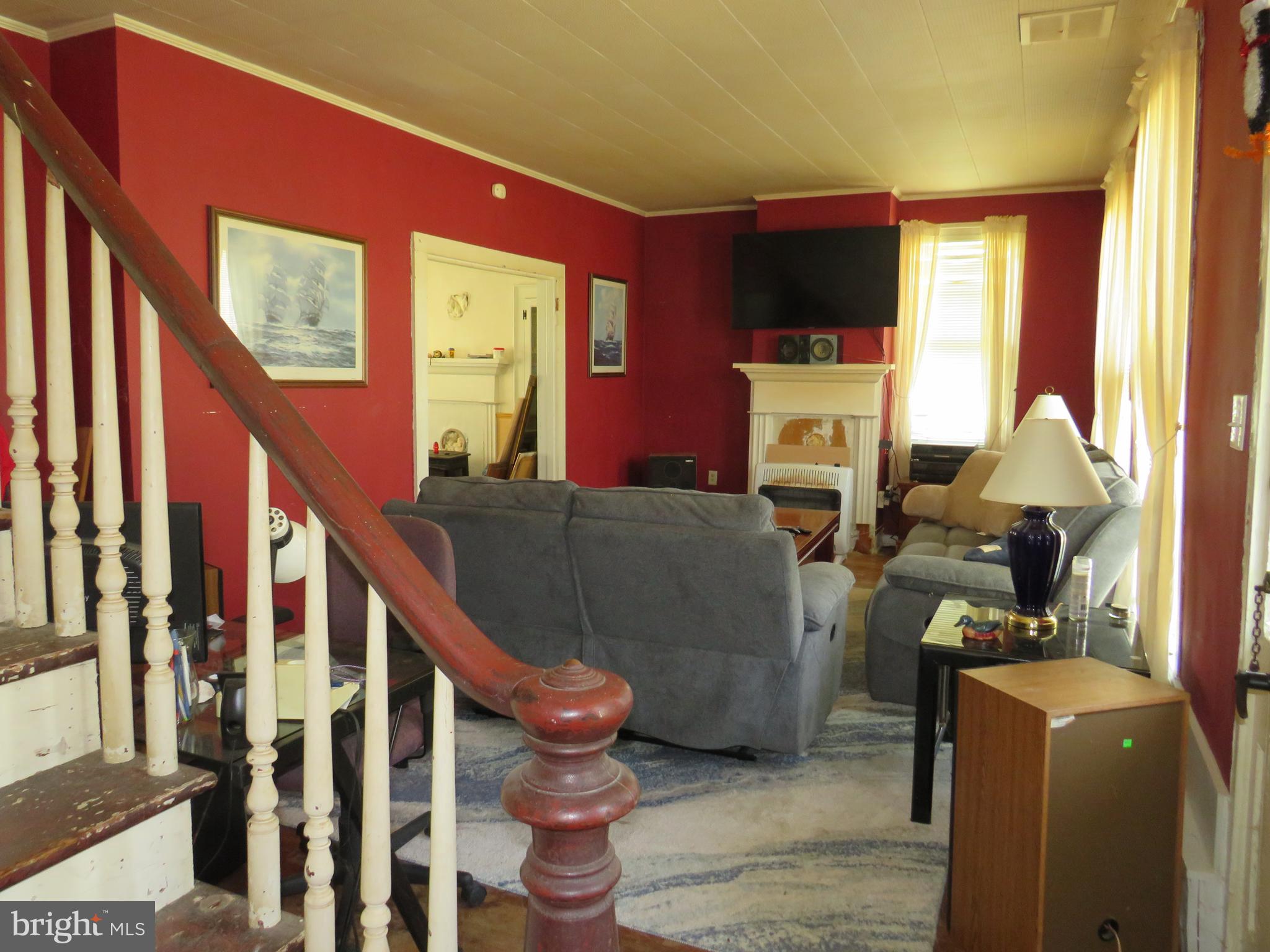 26955 Johnson Creek Road Crisfield, MD 21817 - Photo 16 of 35 a living room with furniture windows and a flat screen tv