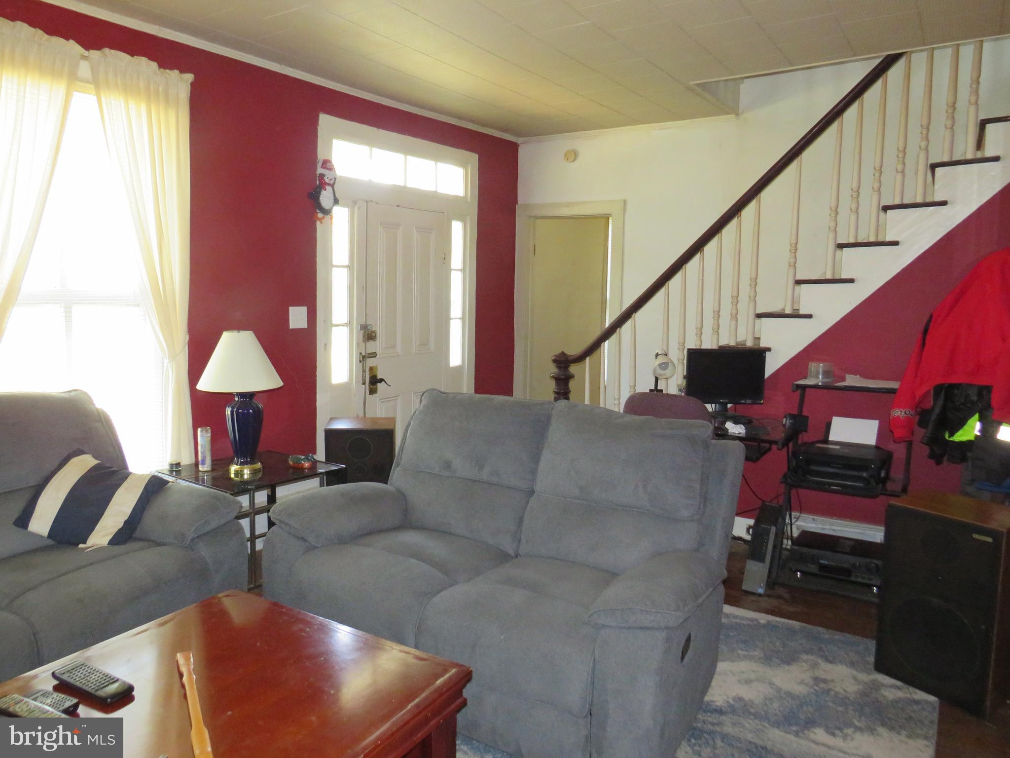 26955 Johnson Creek Road Crisfield, MD 21817 - Photo 18 of 35 a living room with furniture or couch and a potted plant