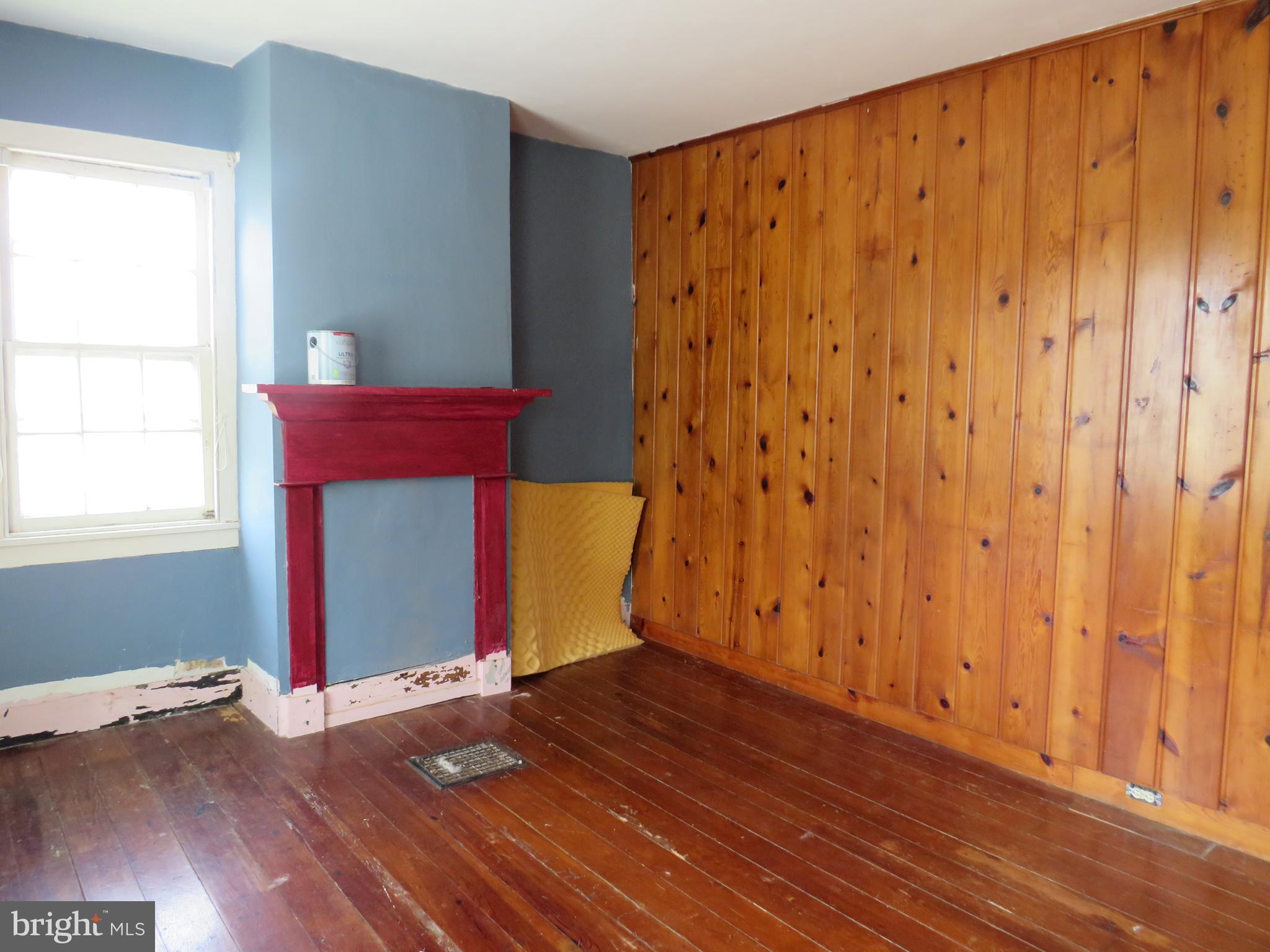26955 Johnson Creek Road Crisfield, MD 21817 - Photo 24 of 35 a view of an empty room with wooden floor and a window