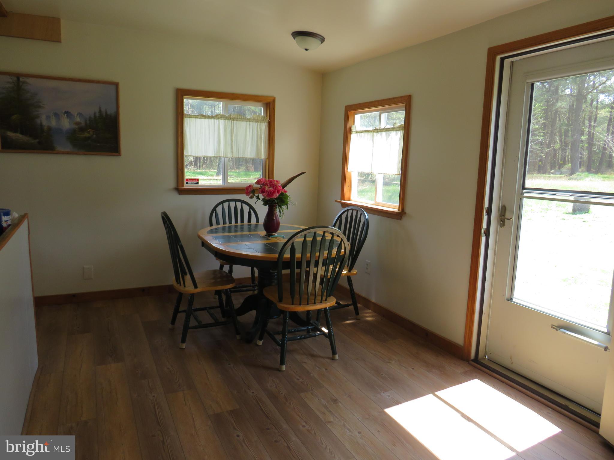 26955 Johnson Creek Road Crisfield, MD 21817 - Photo 9 of 35 a dining room with furniture and window