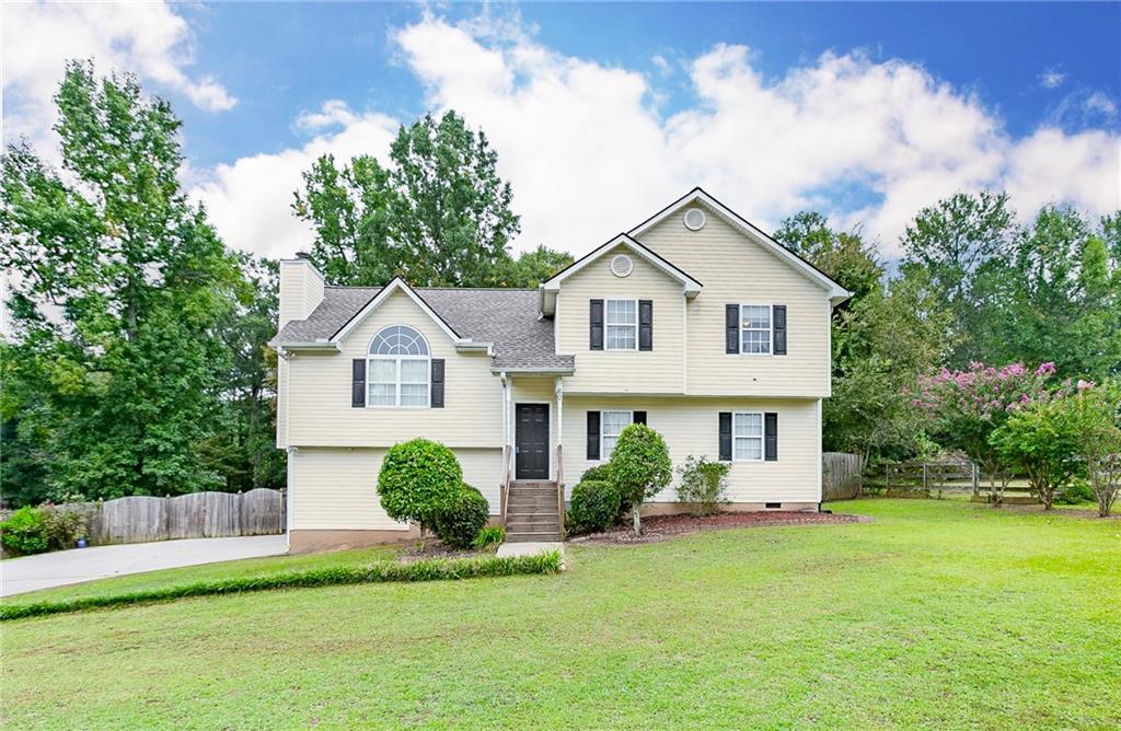 60 Live Oak Run Cartersville, GA 30121 - Photo 1 of 1 a front view of a house with a yard and garage
