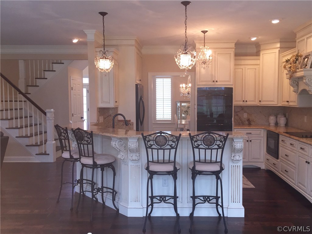 13700 River Road Chesterfield, VA 23838 - Photo 2 of 10 a view of a dining room with furniture and wooden floor