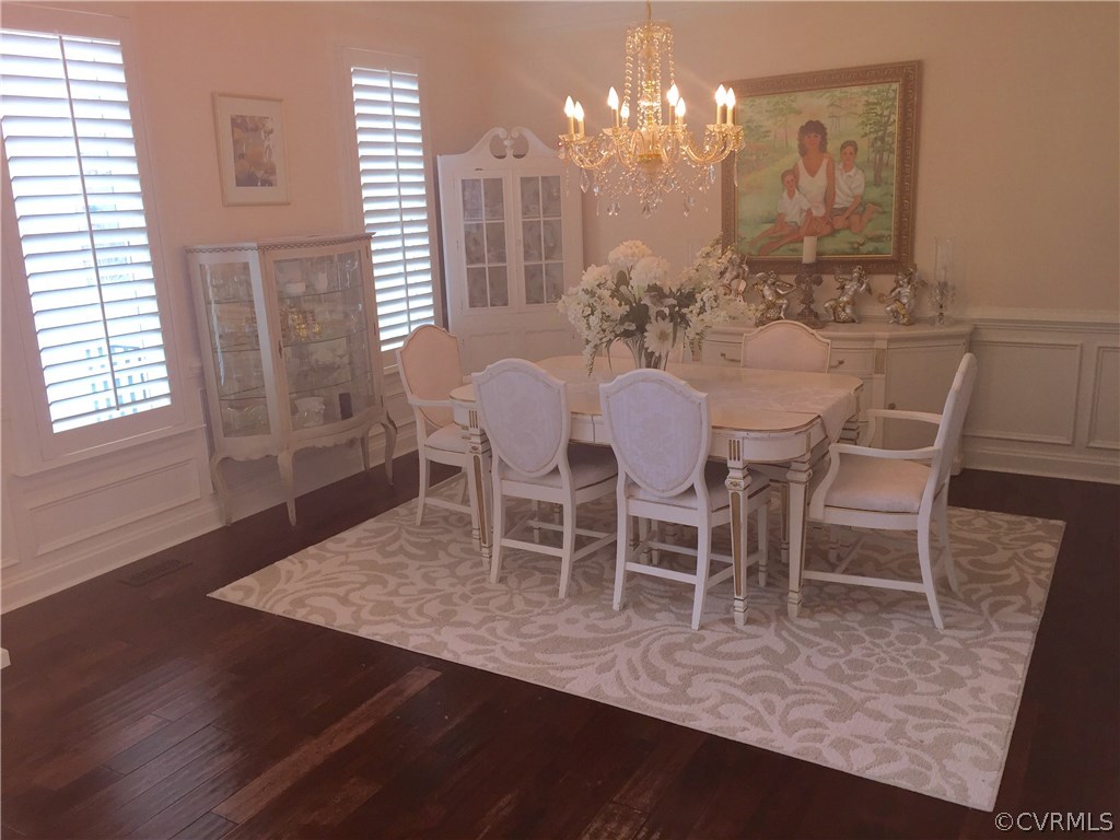 13700 River Road Chesterfield, VA 23838 - Photo 3 of 10 a view of a dining room with furniture and chandelier