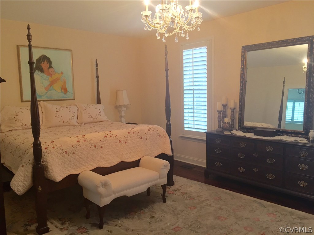 13700 River Road Chesterfield, VA 23838 - Photo 6 of 10 a bedroom with a bed dresser and a window