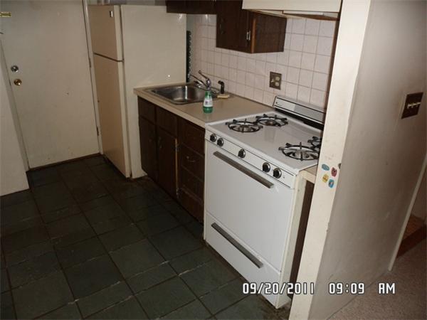 128 Mammoth Road, Unit 5 Hooksett, NH 03106 - Photo 3 of 5 a white stove top oven sitting inside of a kitchen