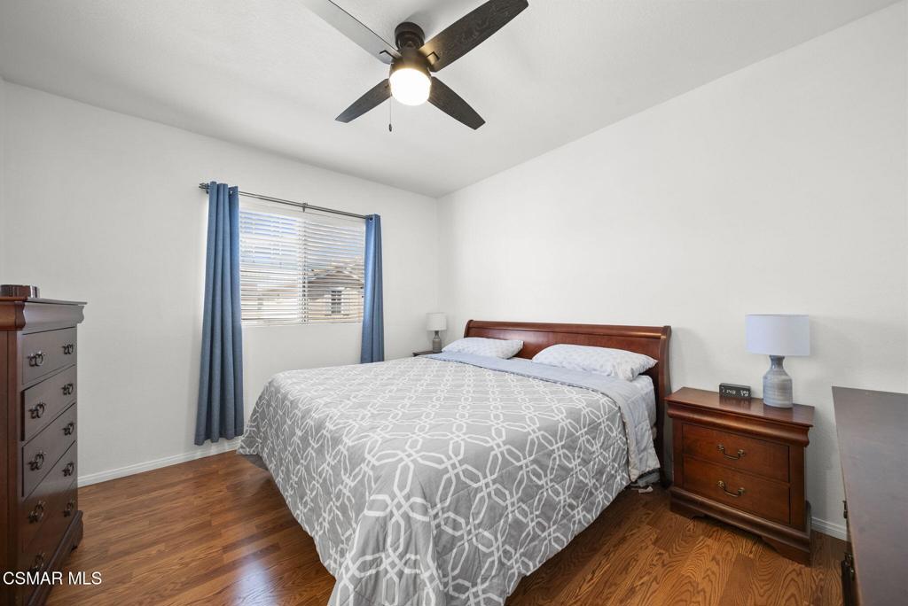 1838 Amberleaf Lane Simi Valley, CA 93065 - Photo 20 of 39 a bedroom with a bed and a ceiling fan