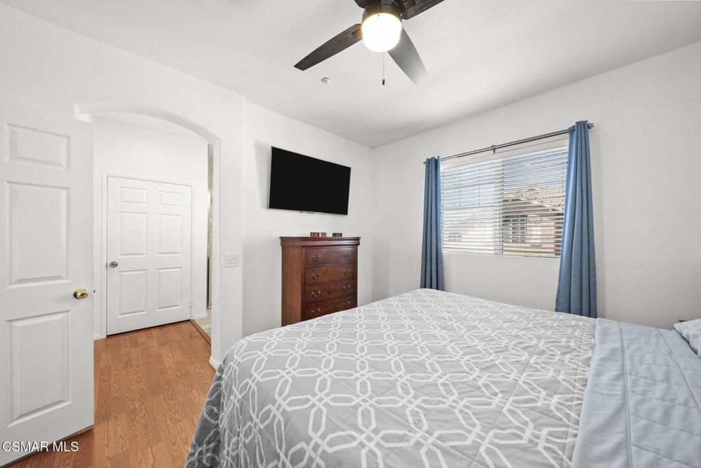 1838 Amberleaf Lane Simi Valley, CA 93065 - Photo 21 of 39 a bedroom with a large bed and a flat screen tv