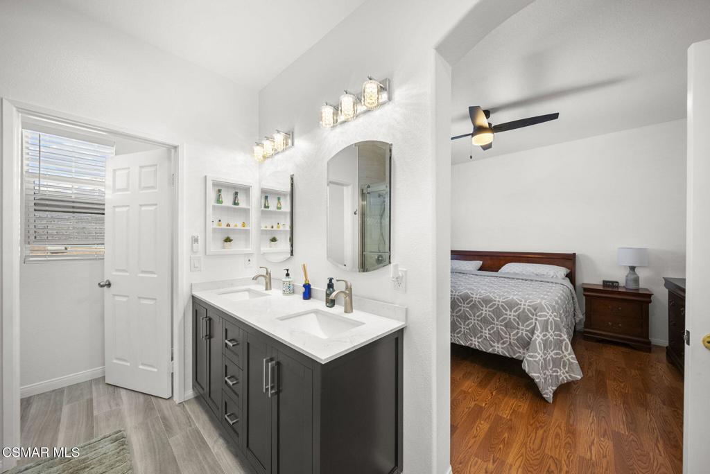 1838 Amberleaf Lane Simi Valley, CA 93065 - Photo 24 of 39 a en suite bathroom with a double vanity sink and a mirror