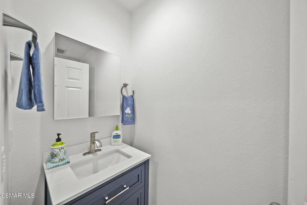 1838 Amberleaf Lane Simi Valley, CA 93065 - Photo 7 of 39 a bathroom with a sink vanity and a mirror