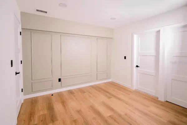 a bathroom with a sink a vanity and a mirror