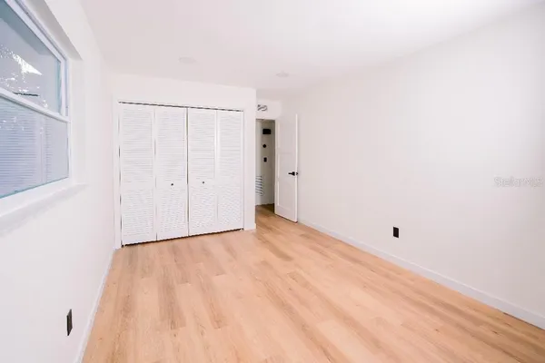 a view of an empty room with a window