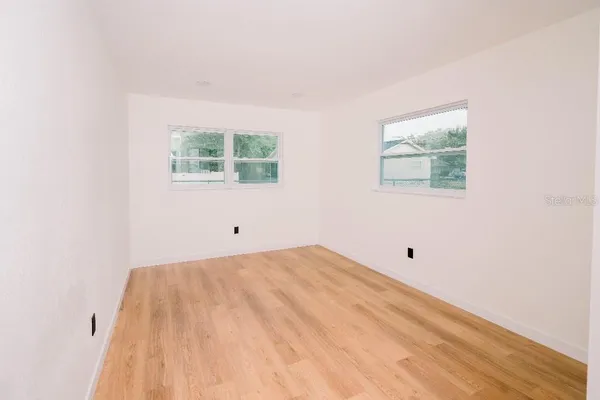 a bathroom with mirror a sink and vanity
