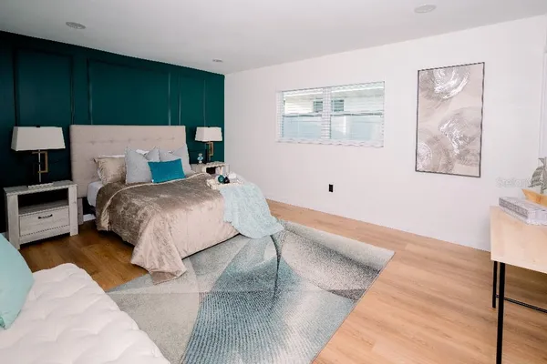 a bedroom with a bed and a cabinets