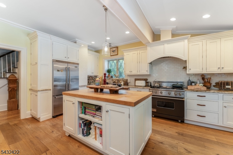 11 New Street Mendham, NJ 07945 - Photo 8 of 35 a kitchen with kitchen island a sink stainless steel appliances and cabinets