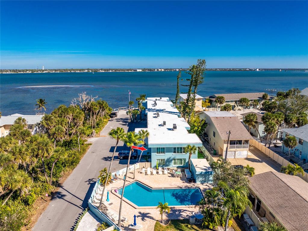 5055 North Beach Road, Unit 208 Englewood, FL 34223 - Photo 2 of 43 a terrace with outdoor seating and city view