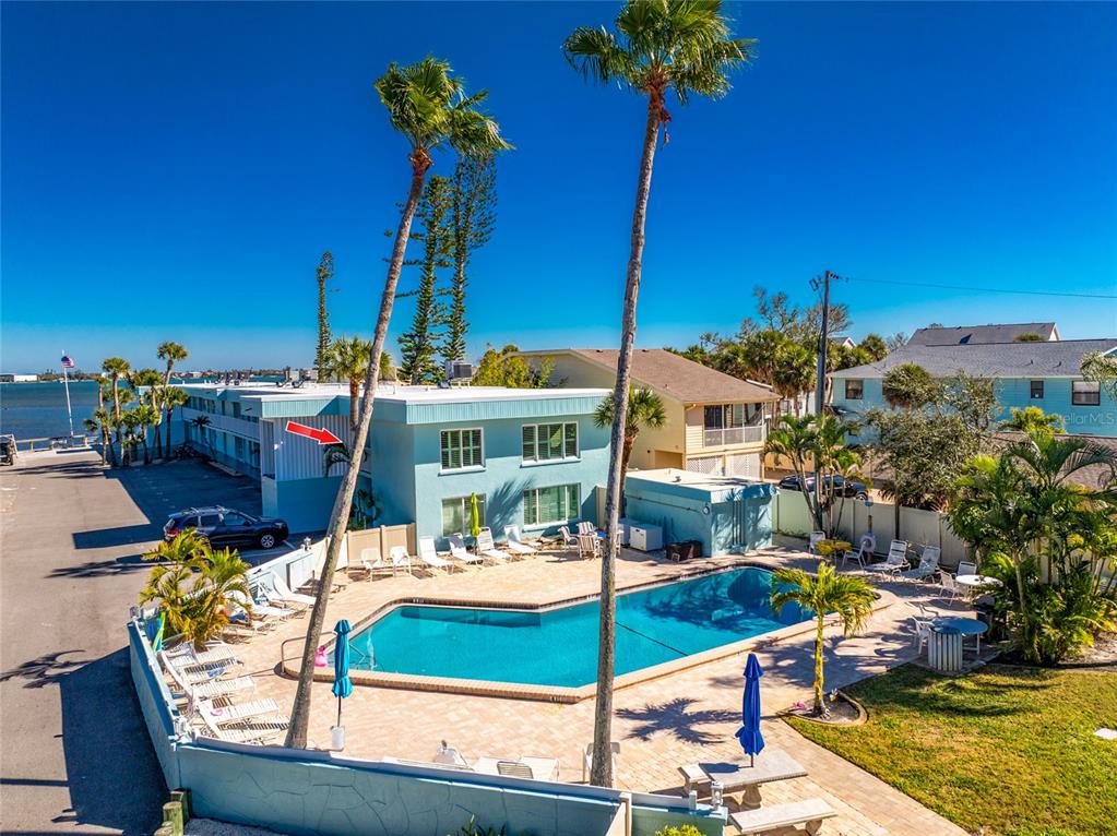 5055 North Beach Road, Unit 208 Englewood, FL 34223 - Photo 29 of 43 a view of a swimming pool with a patio