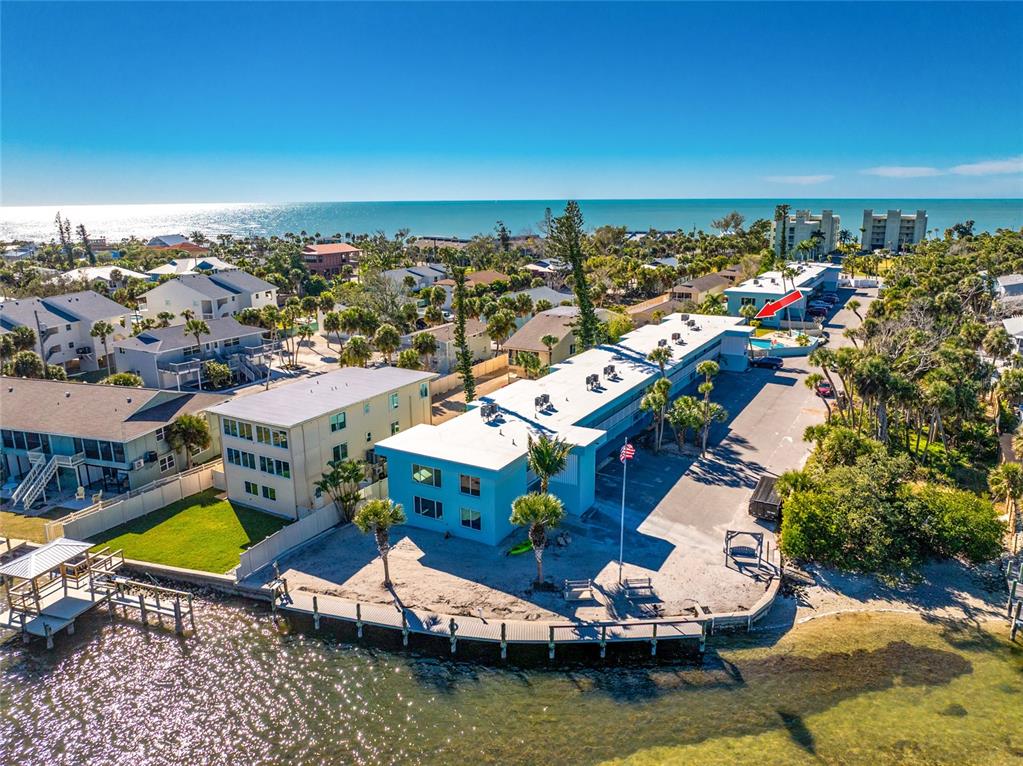5055 North Beach Road, Unit 208 Englewood, FL 34223 - Photo 37 of 43 an aerial view of a house with a garden and lake view