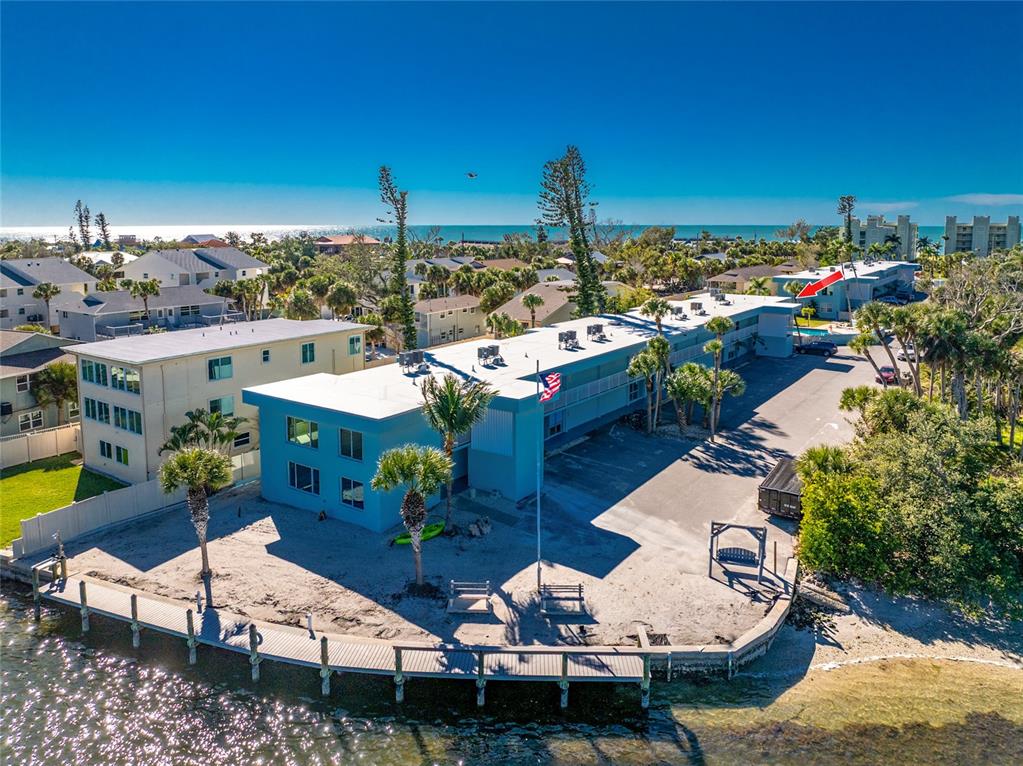 5055 North Beach Road, Unit 208 Englewood, FL 34223 - Photo 38 of 43 a view of a terrace with chairs and potted plants
