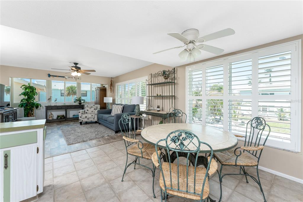 5055 North Beach Road, Unit 208 Englewood, FL 34223 - Photo 4 of 43 a view of a dining room with furniture window and outside view